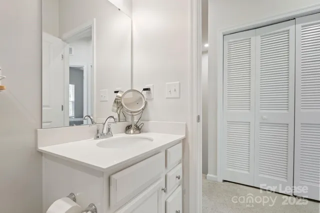 a view of living room kitchen with patio furniture and wooden floor