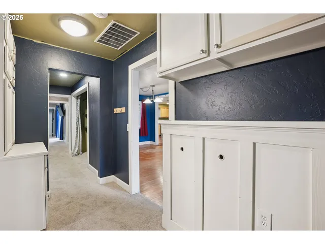 a view of kitchen with furniture and cabinets