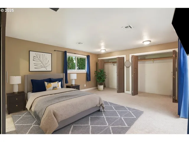 a bedroom with a bed and a desk