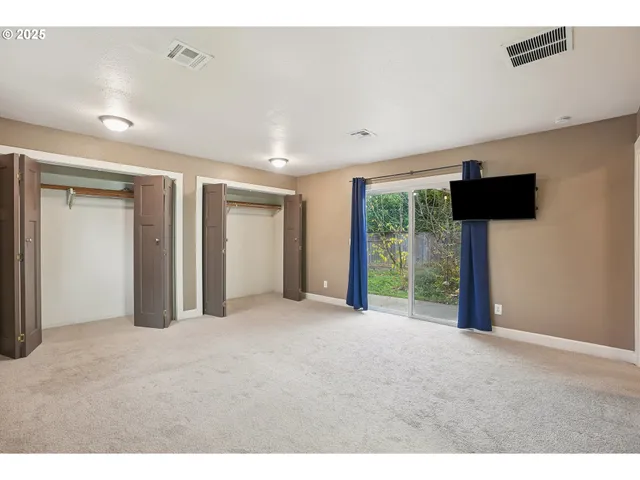 a view of empty room with floor to ceiling window