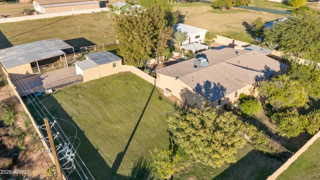 an aerial view of a residential houses with outdoor space