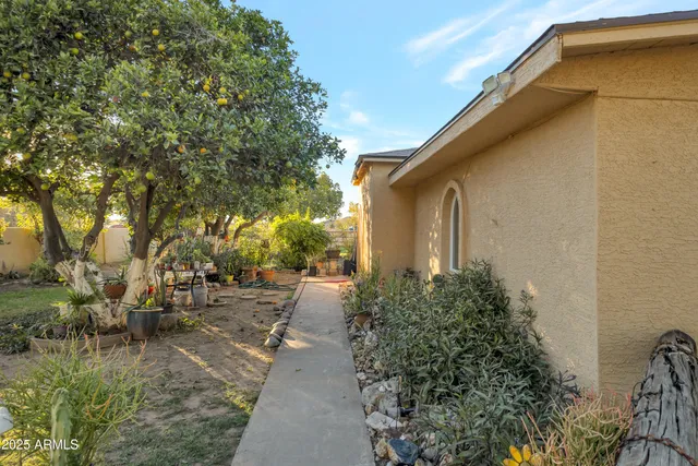 a front view of a house with swimming pool having outdoor seating