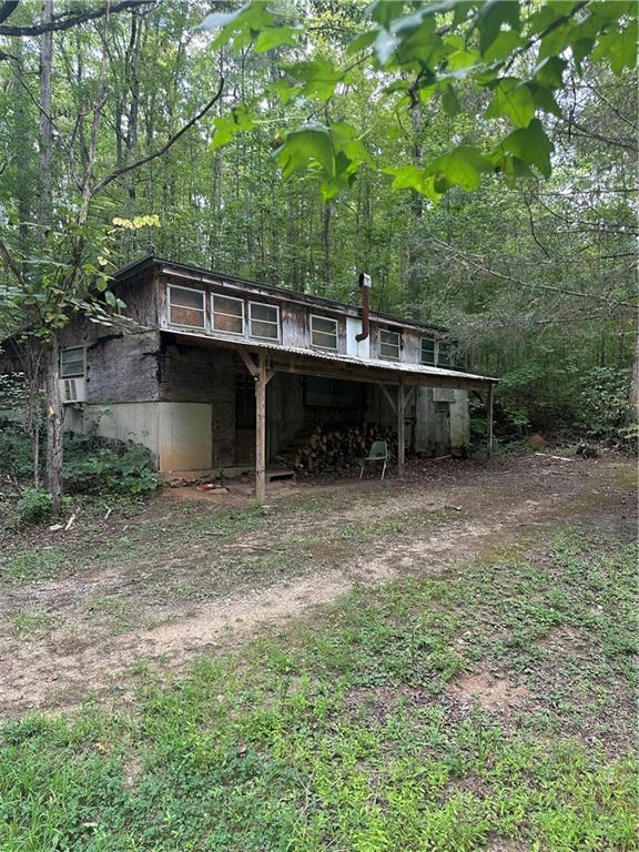 308 Old Whitestone Road East Talking Rock, GA 30175 - Photo 3 of 26 a view of a wooden deck with a yard