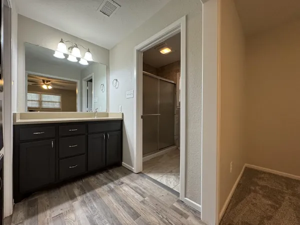a bathroom with a double vanity sink and a mirror