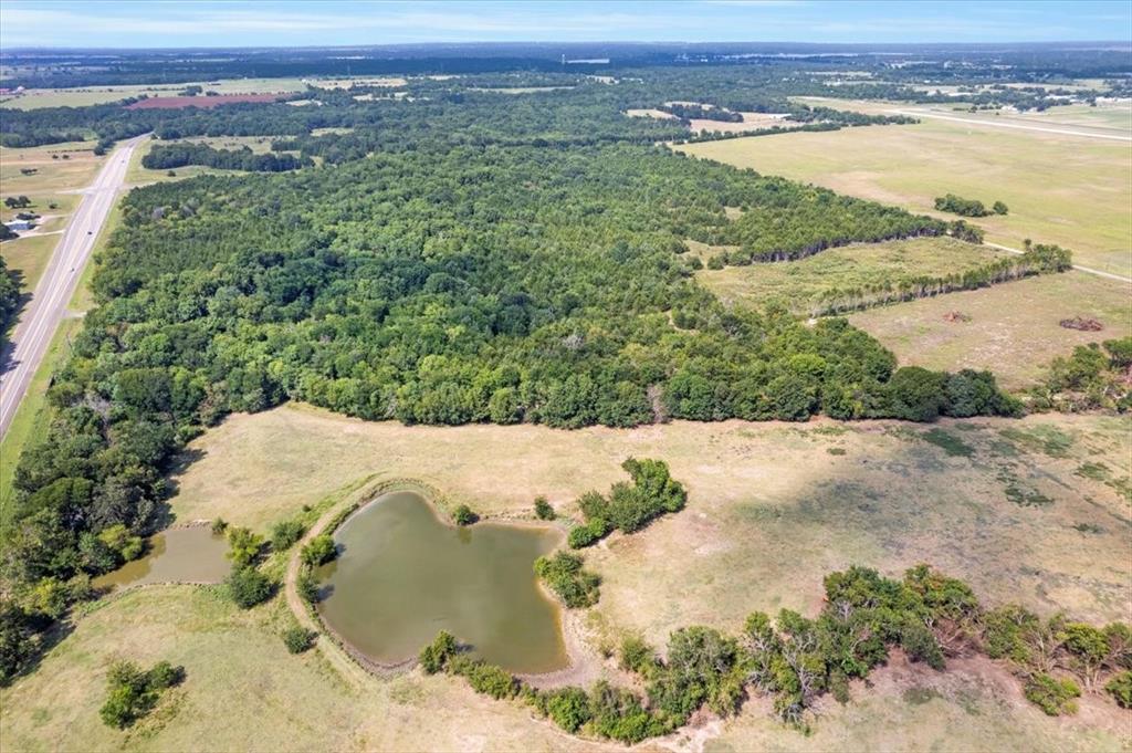 0 Tx-121 & Airport Road Bonham, TX 75418 - Photo 5 of 18 a view of a lake with a mountain