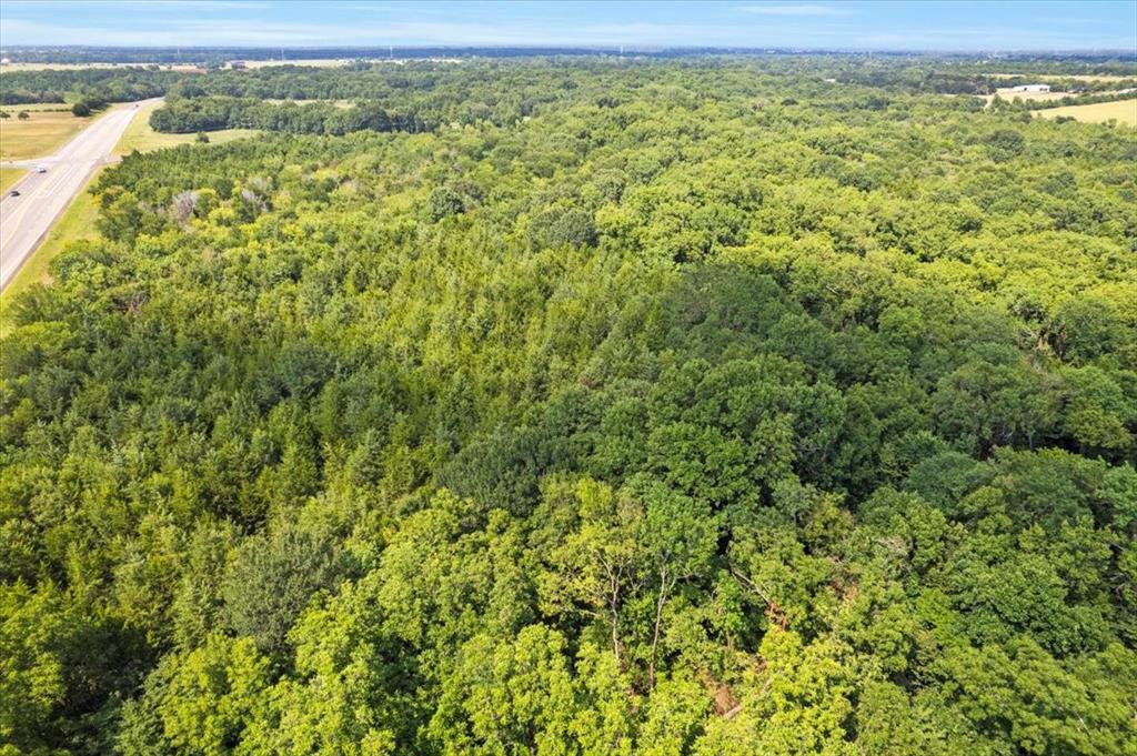 0 Tx-121 & Airport Road Bonham, TX 75418 - Photo 7 of 18 a view of a field with an outdoor space