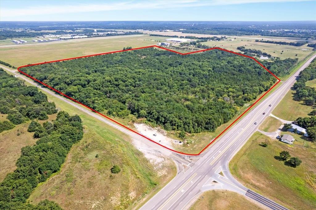 0 Tx-121 & Airport Road Bonham, TX 75418 - Photo 8 of 18 a view of a swimming pool with a lake from a balcony