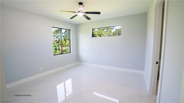 a view of an empty room with a window