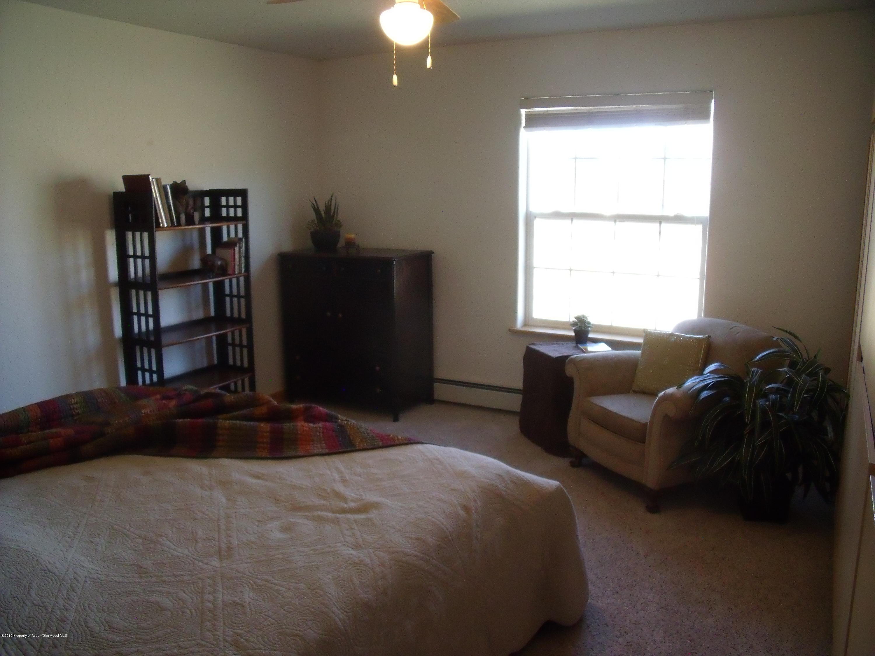 200 Fox Run Road Rifle, CO 81650 - Photo 8 of 21 a bedroom with a bed and a window