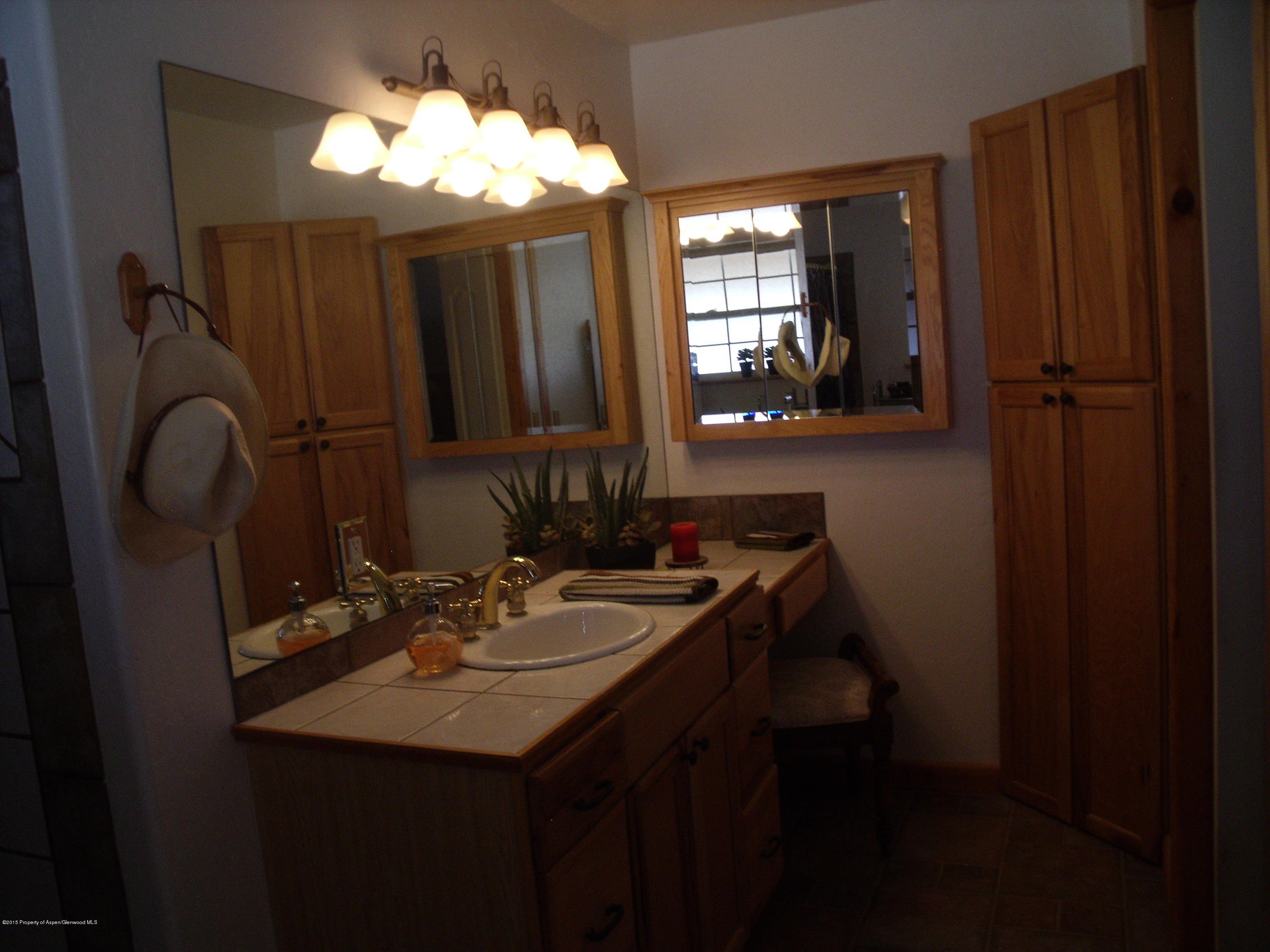 200 Fox Run Road Rifle, CO 81650 - Photo 10 of 21 a bathroom with a sink double vanity and a mirror