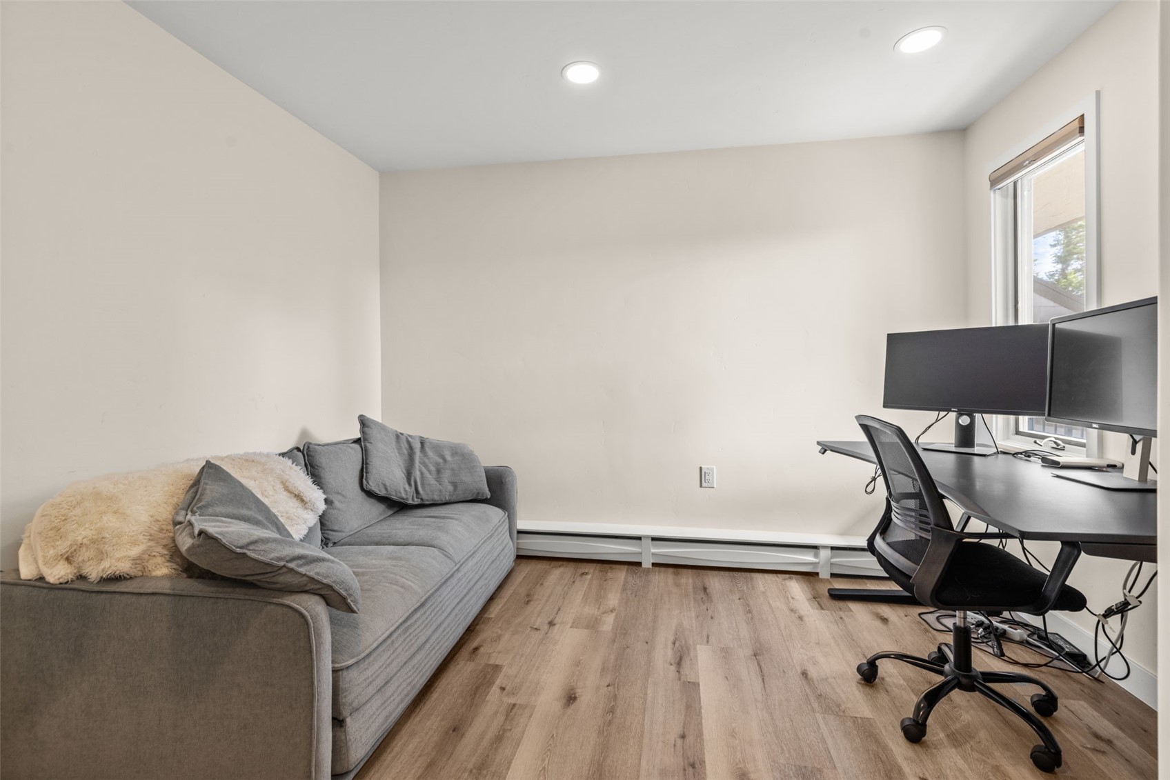 1127 Ski Hill Road, Unit 104 Breckenridge, CO 80424 - Photo 16 of 32 a living room with furniture and a wooden floor