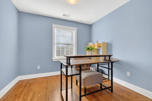 a view of a workspace with furniture