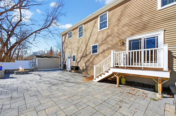 a view of a house with a bench