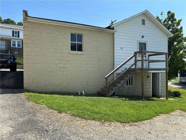 a backyard of a house with lots of green space