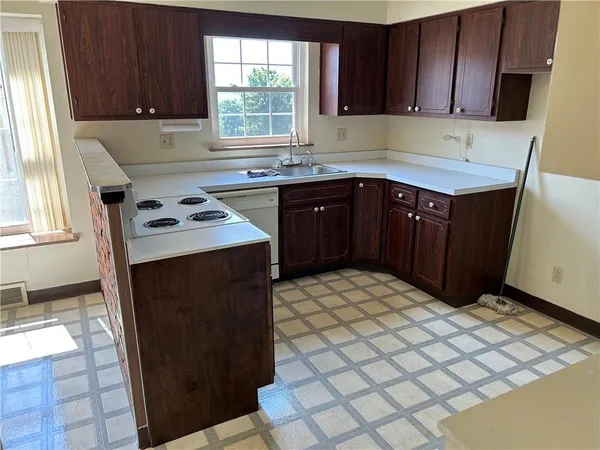 a kitchen with a cabinets and window