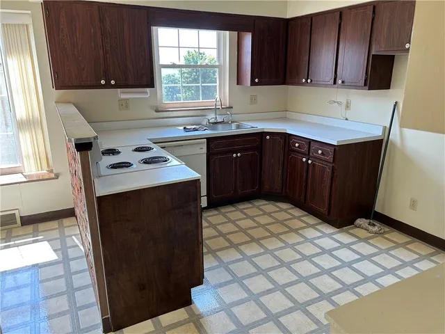 a kitchen with a cabinets and window