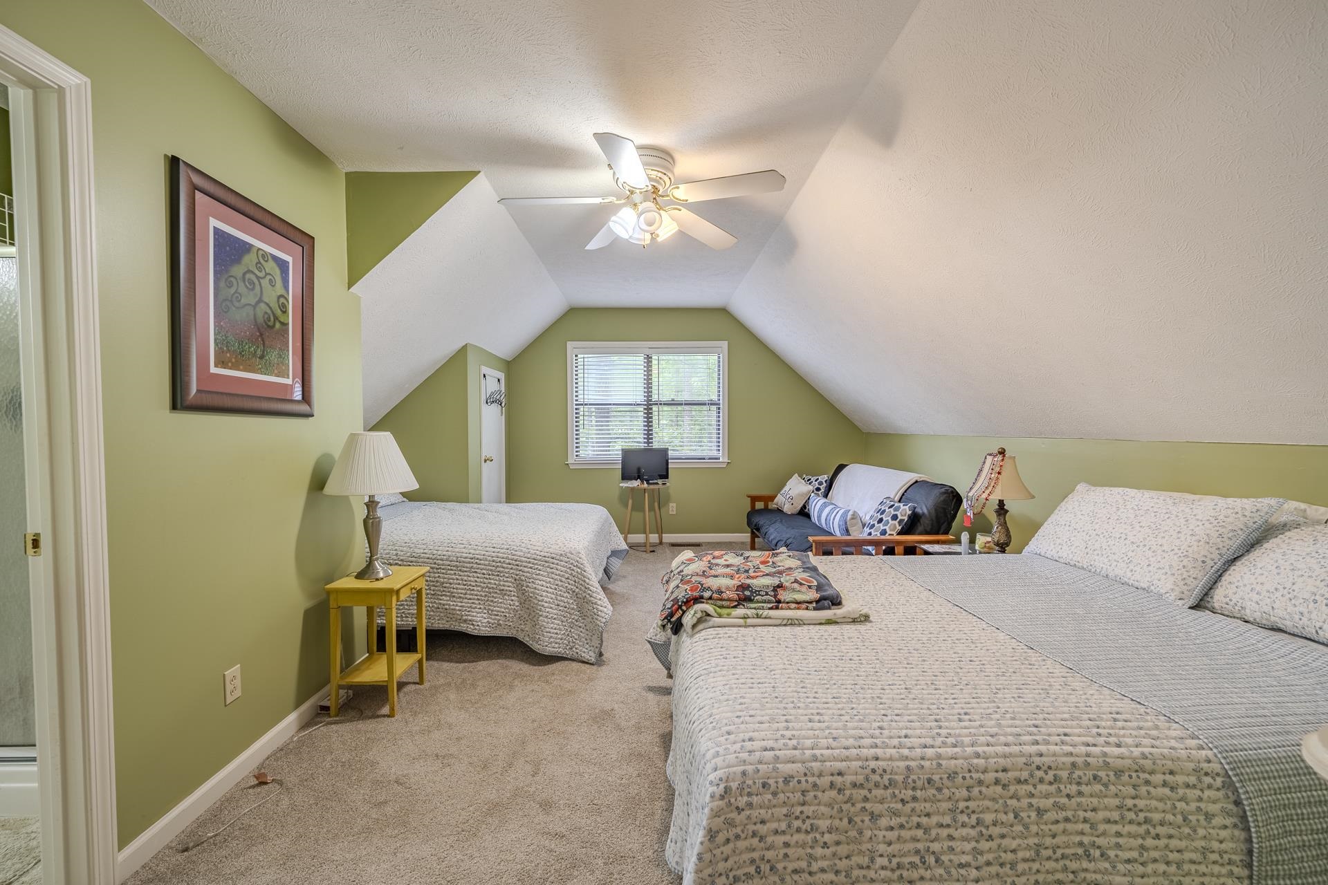 405 Murray Lane Counce, TN 38326 - Photo 26 of 36 a bedroom with a bed and a chandelier