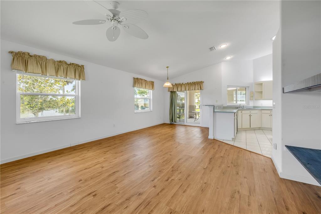 192 Azalea Road Edgewater, FL 32141 - Photo 35 of 94 a view of empty room with wooden floor and fan