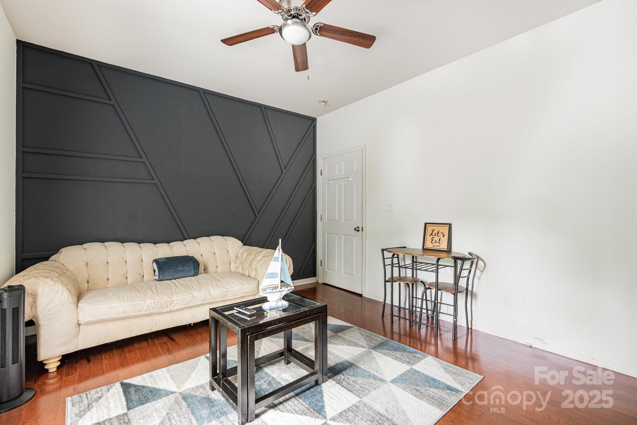 306 Nance Road Charlotte, NC 28214 - Photo 11 of 40 a living room with furniture and a wooden floor