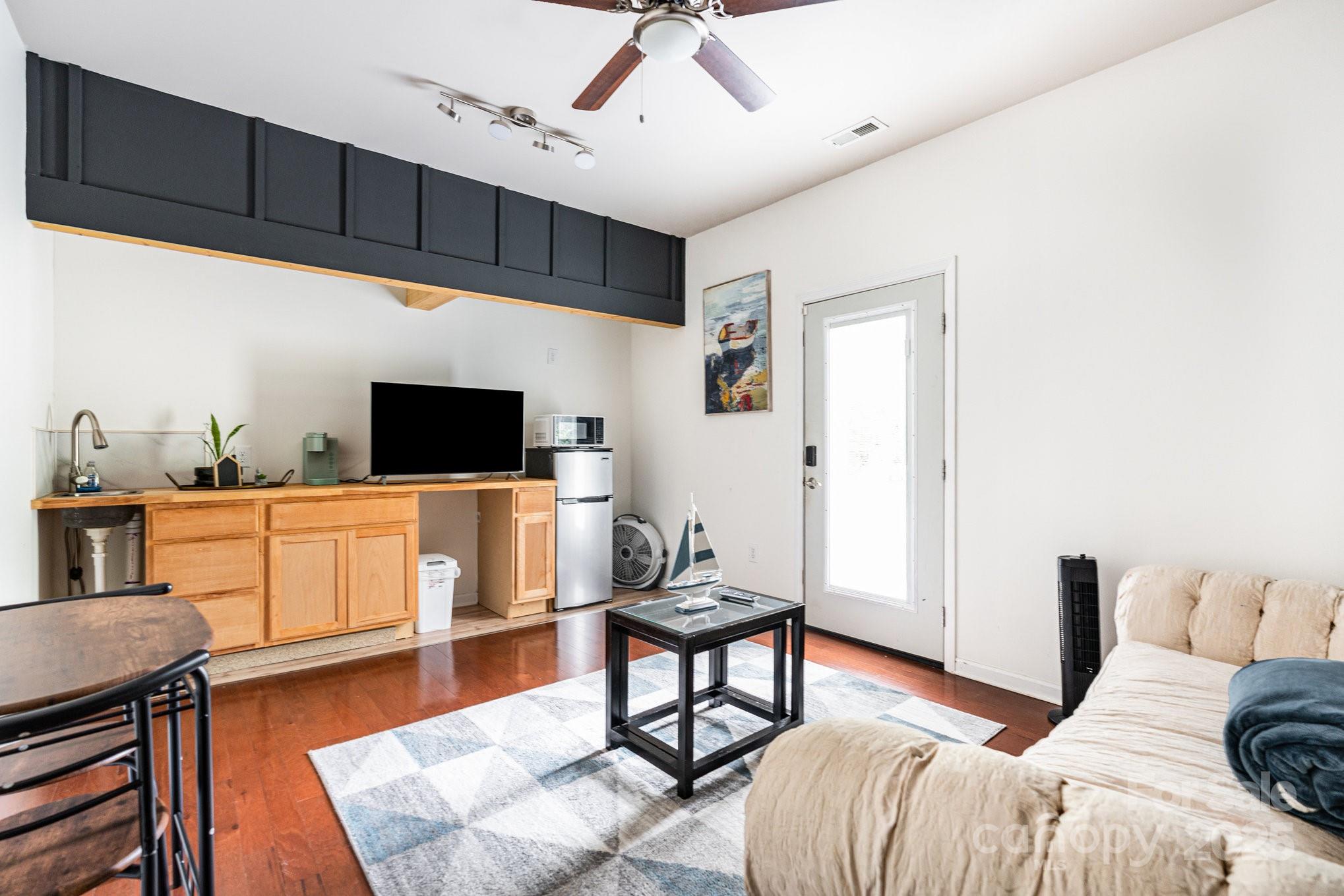 306 Nance Road Charlotte, NC 28214 - Photo 12 of 40 a bedroom with furniture and a flat screen tv
