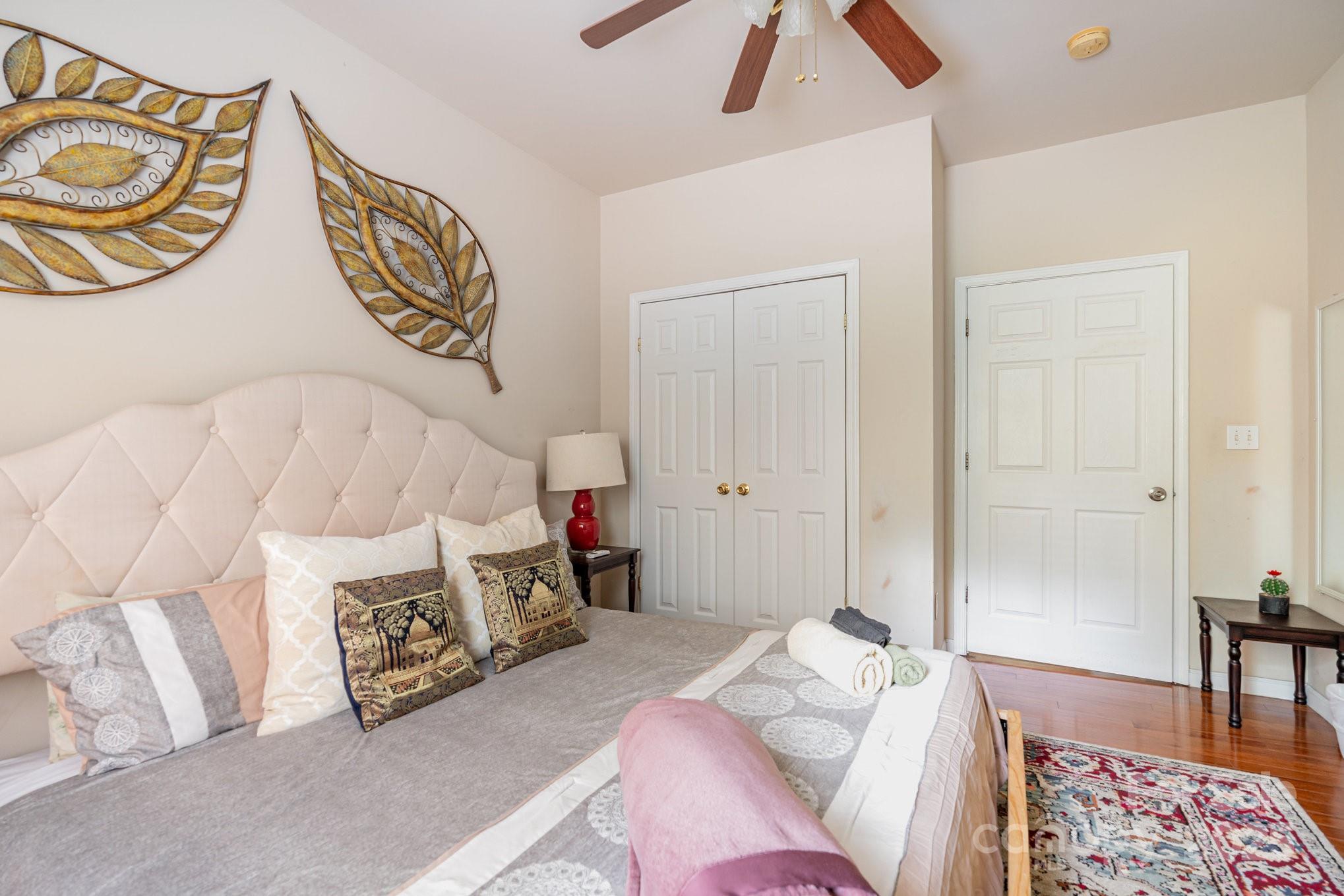 306 Nance Road Charlotte, NC 28214 - Photo 15 of 40 a bedroom with a bed and a lamp