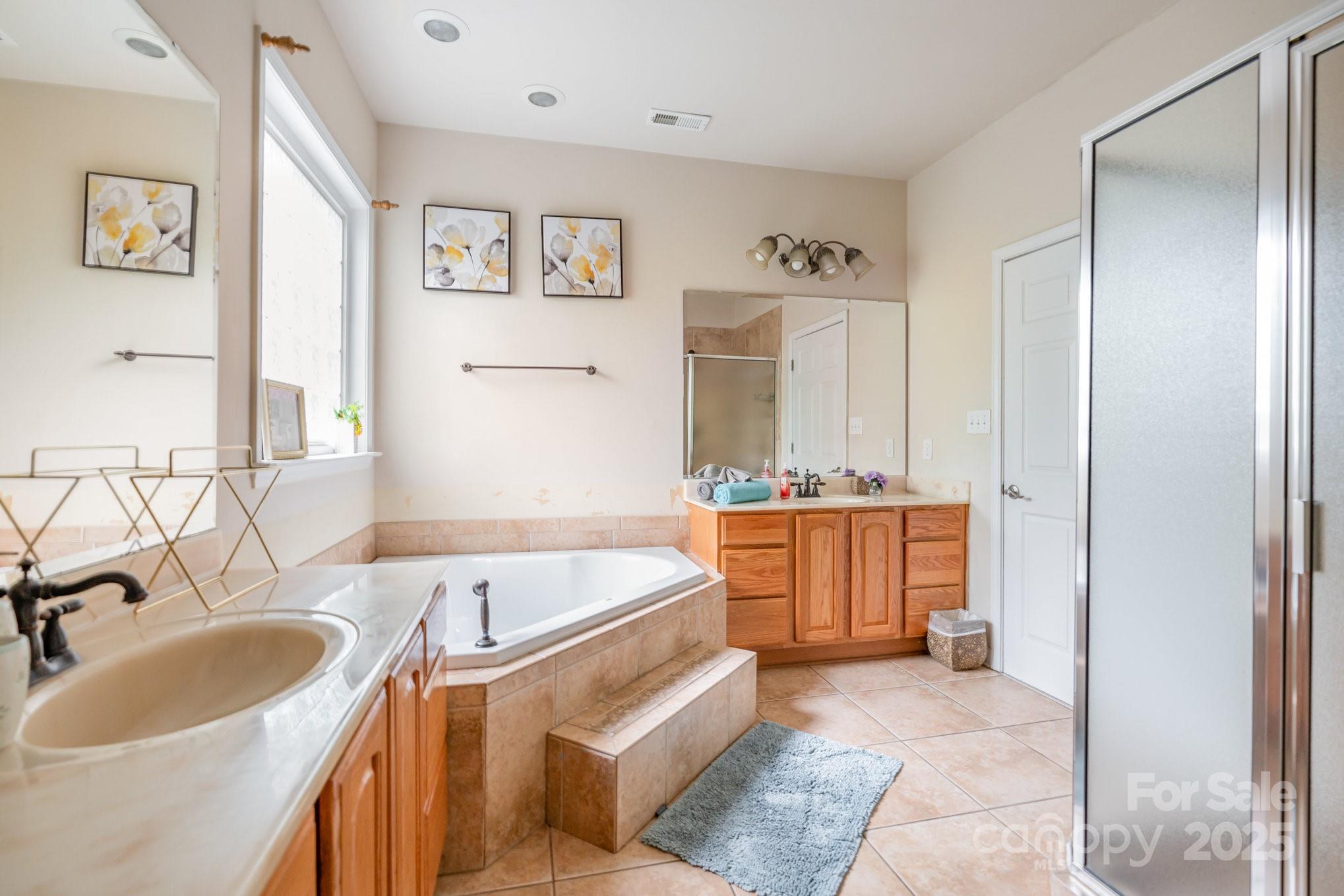 306 Nance Road Charlotte, NC 28214 - Photo 20 of 40 a bathroom with a tub sink and mirror