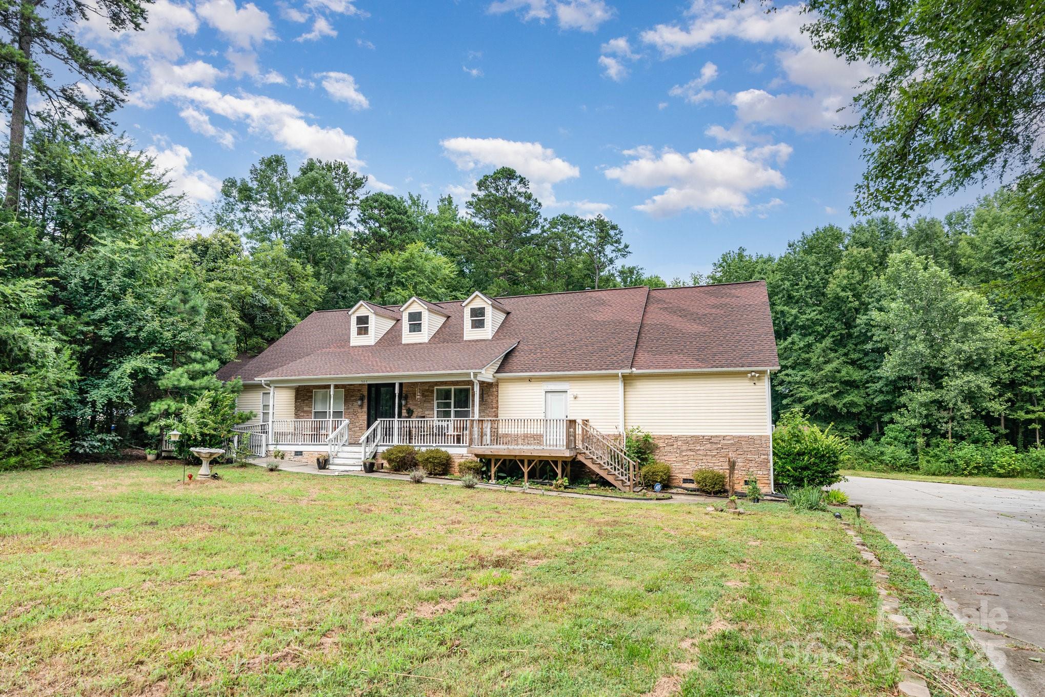306 Nance Road Charlotte, NC 28214 - Photo 2 of 40 a front view of a house with a garden and plants