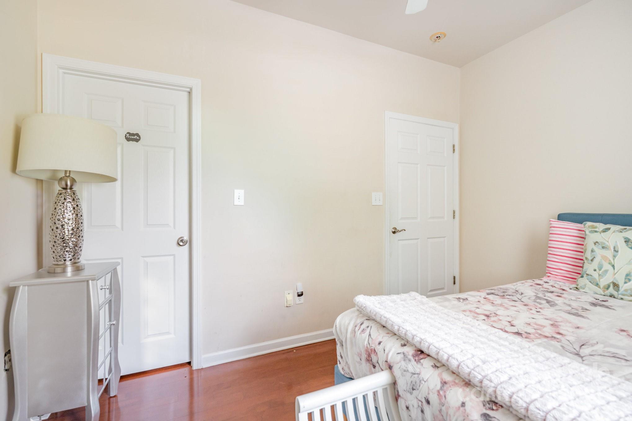 306 Nance Road Charlotte, NC 28214 - Photo 22 of 40 a bedroom with a bed and a table in it