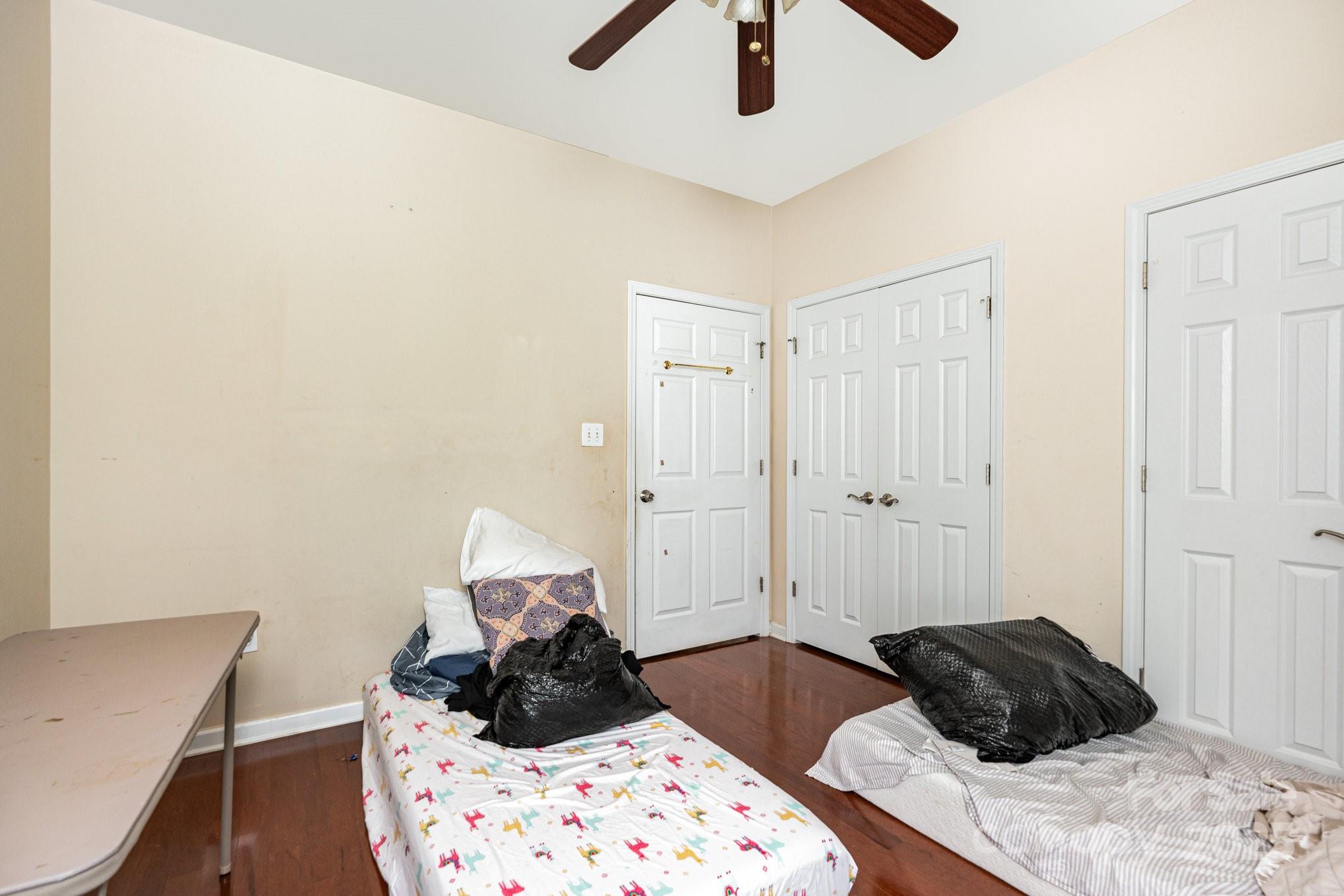 306 Nance Road Charlotte, NC 28214 - Photo 25 of 40 a bedroom with a bed and a chandelier