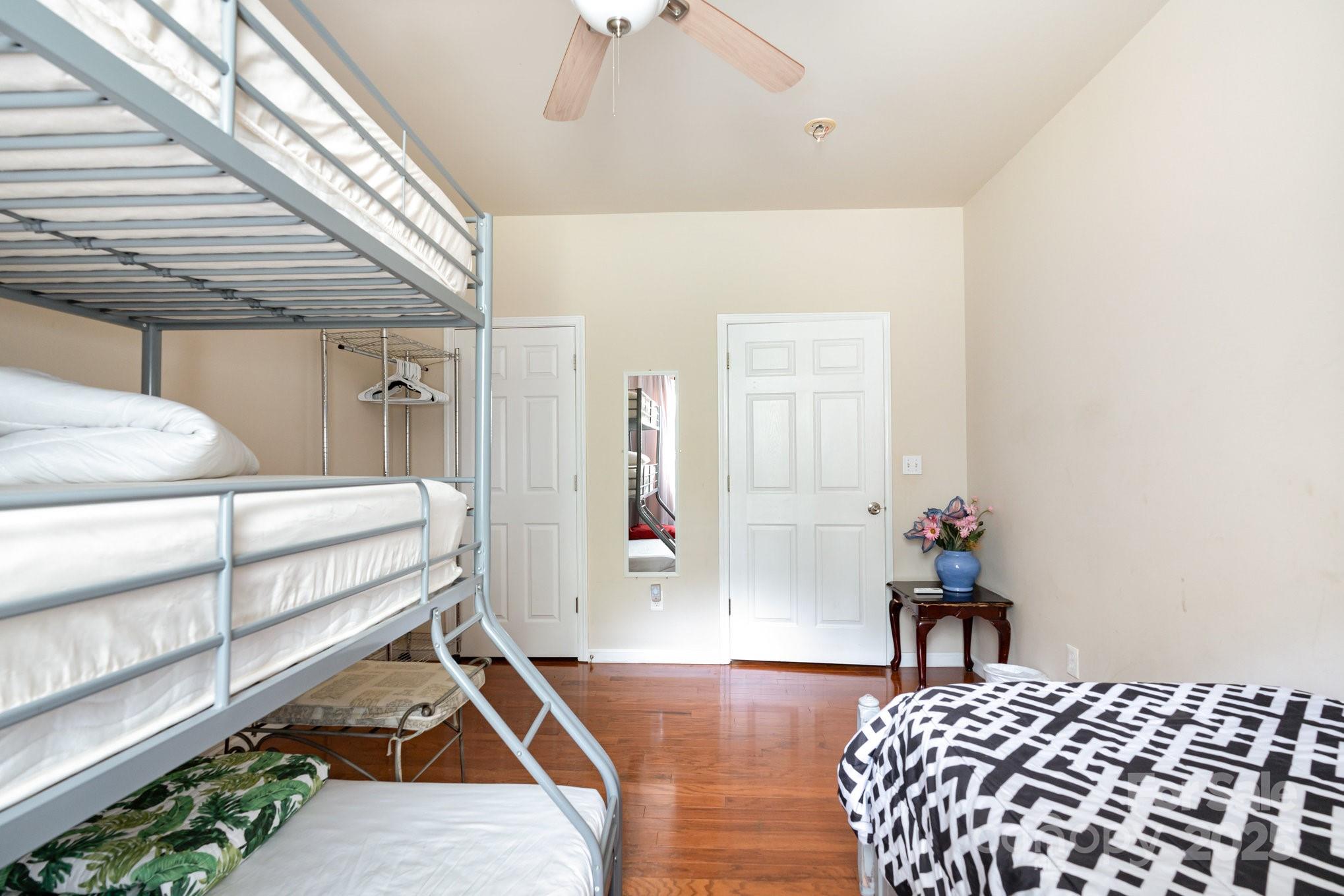 306 Nance Road Charlotte, NC 28214 - Photo 27 of 40 a bedroom with a bed and wooden floor