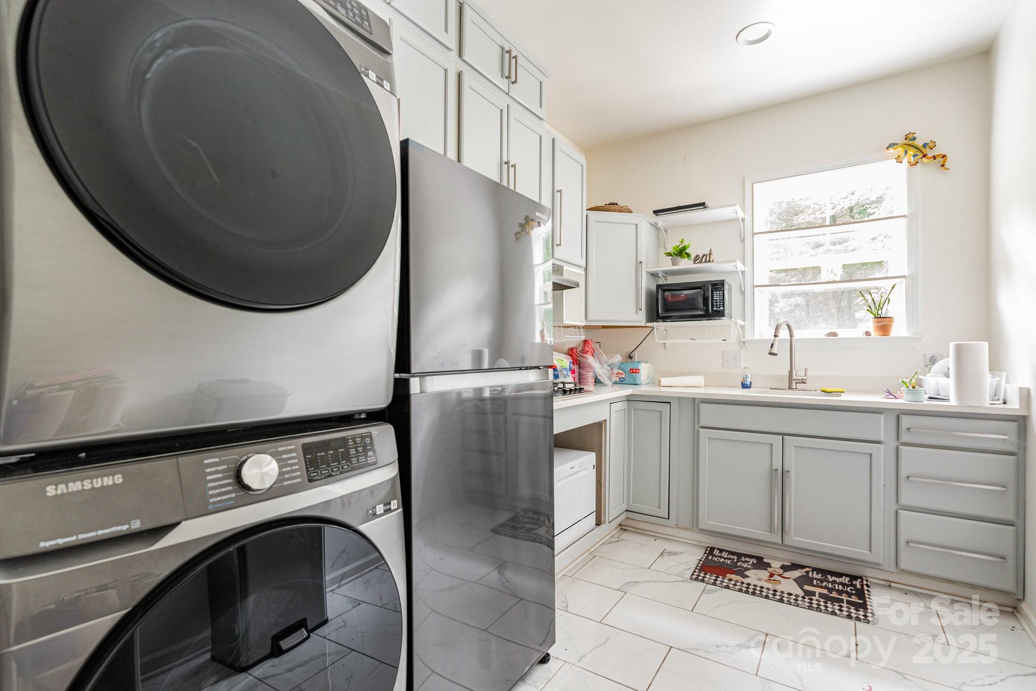 306 Nance Road Charlotte, NC 28214 - Photo 30 of 40 a room with cabinets a washer and dryer