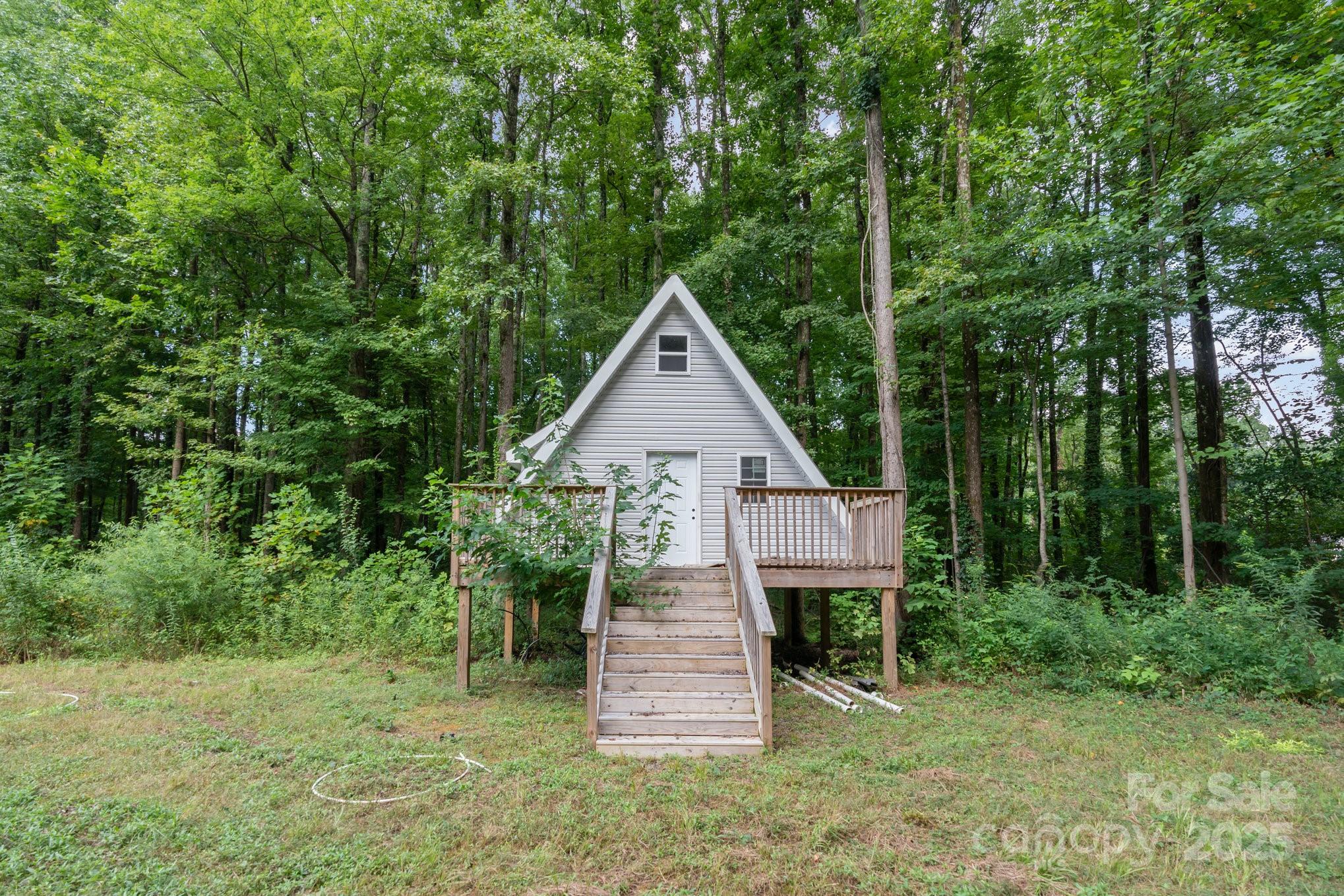 306 Nance Road Charlotte, NC 28214 - Photo 39 of 40 a view of a wooden house and a yard with large trees