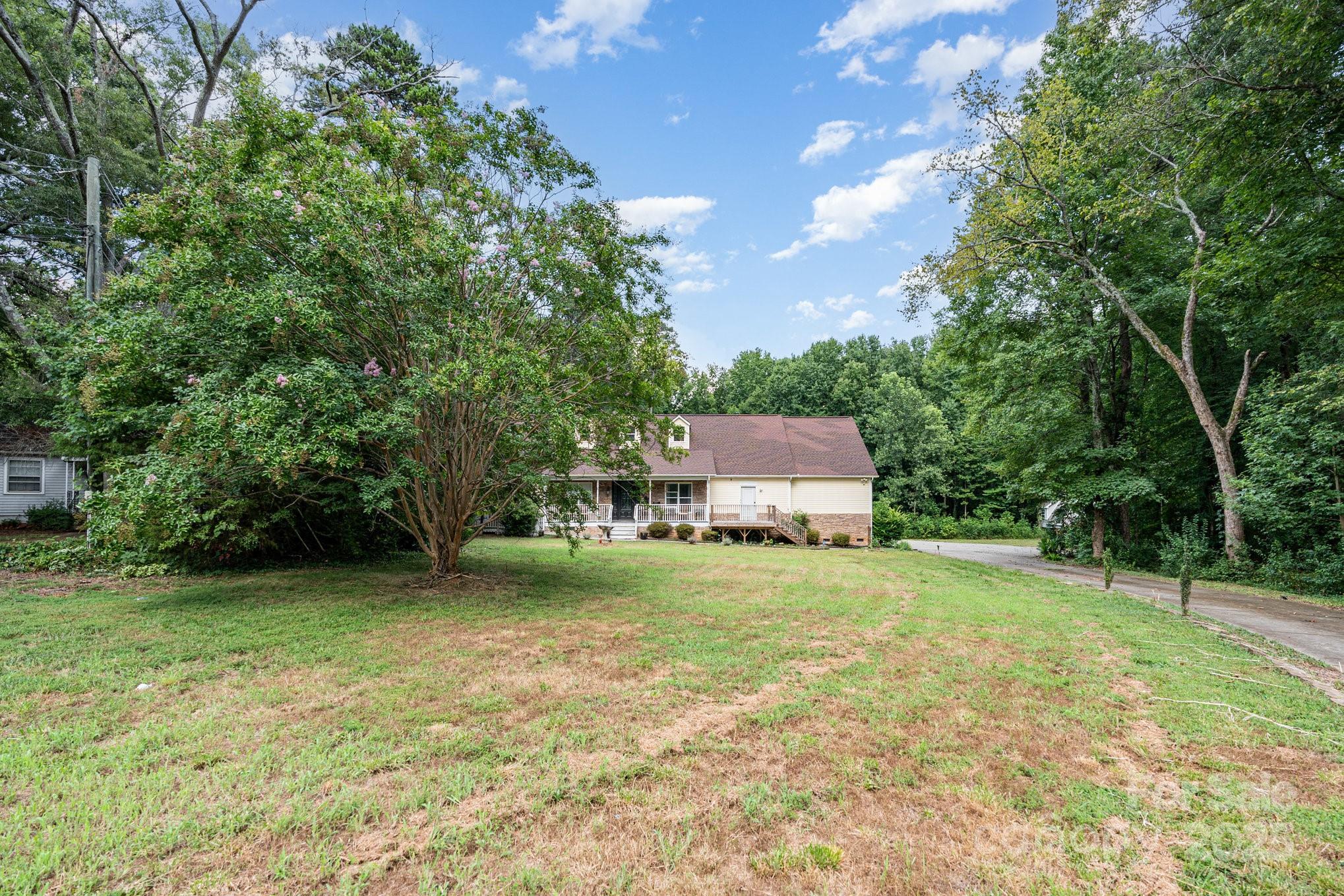 306 Nance Road Charlotte, NC 28214 - Photo 4 of 40 a house view with a garden space