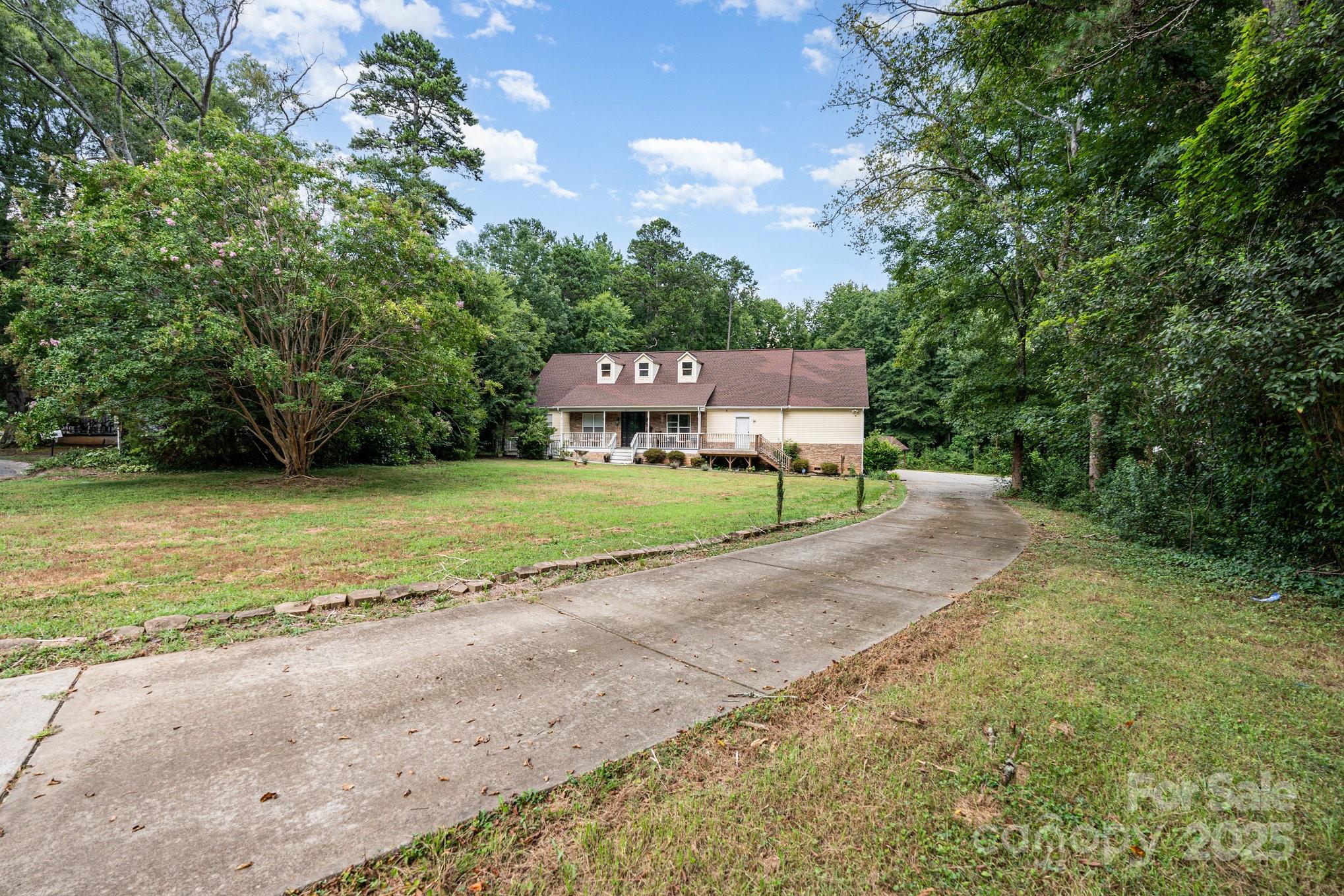 306 Nance Road Charlotte, NC 28214 - Photo 5 of 40 a view of a house with a yard