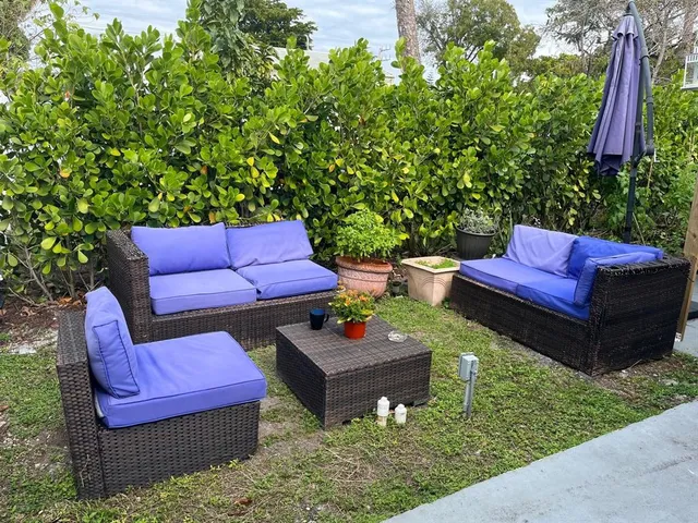 a view of a yard with furniture