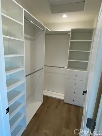 a view of an empty walk in closet