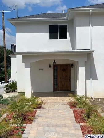 a house with trees in the background