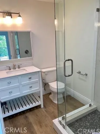 a bathroom with a sink a mirror and a shower