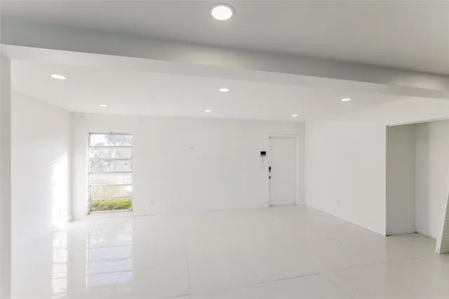 a kitchen with stainless steel appliances a sink stove and refrigerator
