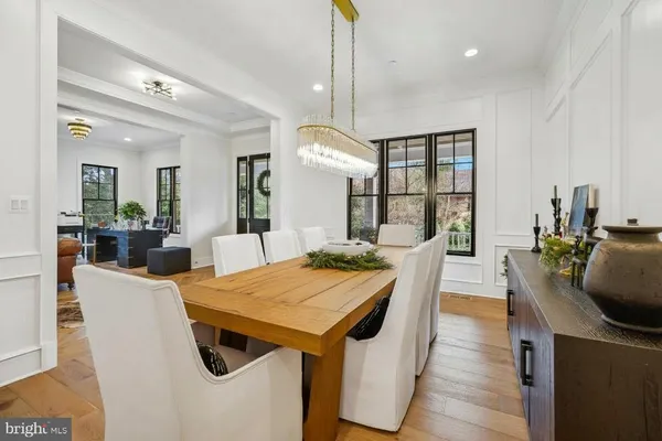 a living room with furniture fireplace and a large window
