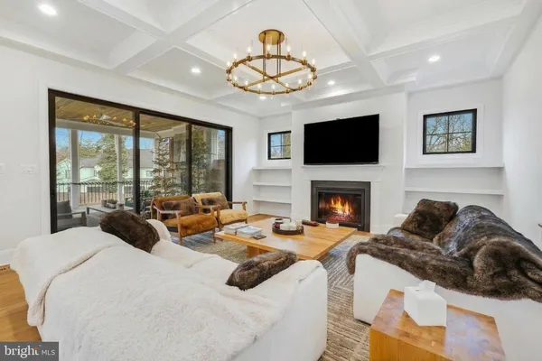 a kitchen with a dining table chairs stove and kitchen view