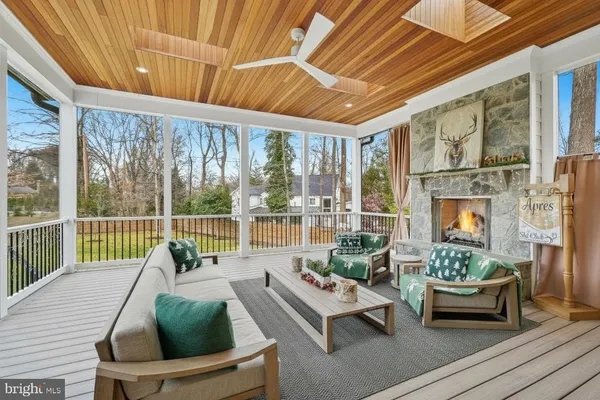 a kitchen with white cabinets and appliances