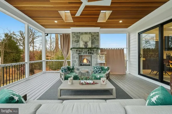 a kitchen with kitchen island granite countertop a sink appliances cabinets and a counter top space