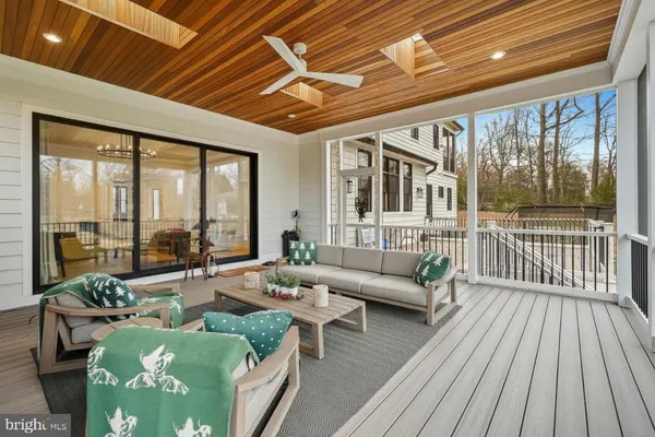 a large kitchen with kitchen island a sink a counter space and stainless steel appliances