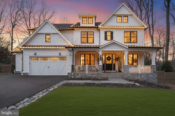 a view of a porch with furniture and floor to ceiling window