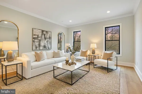 a bedroom with bed and a large window