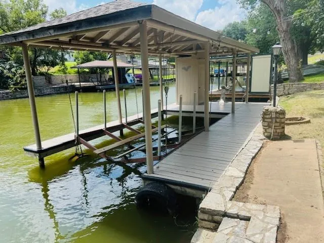 a view of a swimming pool with a patio