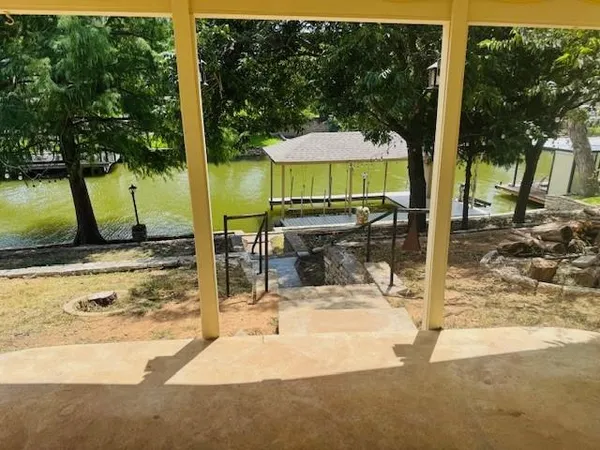 a view of a swimming pool with a patio