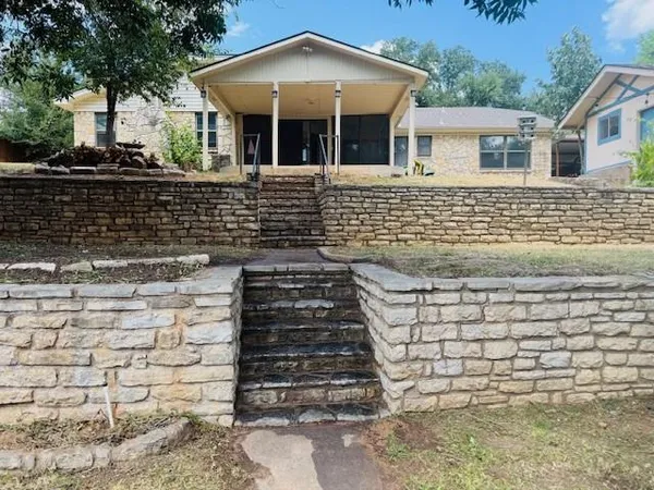 a front view of a house with stairs