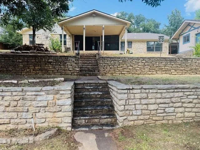 a front view of a house with stairs